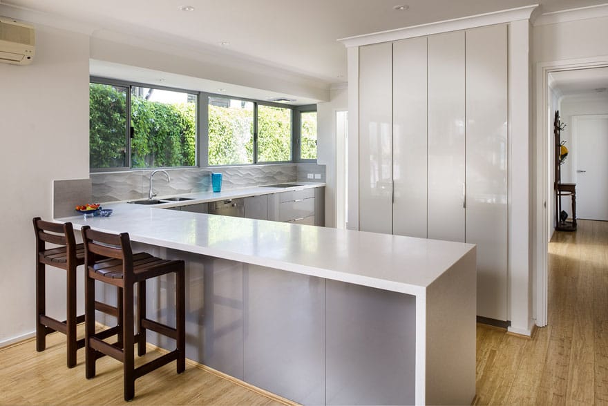 The choice of materials in a grey colour palette, and the selection of different textures produced a great final outcome for this modern kitchen renovation in City Beach.